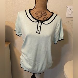 Elle mint color sweater with black outline. Size L